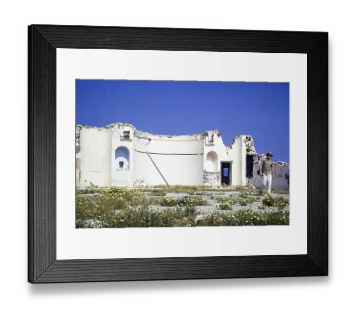 Framed Print : Male man tourist walking by old church ruin, Oia, Santorini, Cyclades islands, Greece, Europe, 1972, Europe