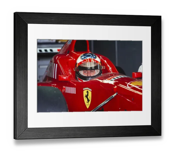 Framed Print : Formula 1 world champion Michael Schumacher sits in the cockpit of his Ferrari F310, German Grand Prix at the Hockenheimring on 28 July 1996