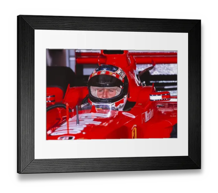 Framed Print : Formula 1 world champion Michael Schumacher sits in the cockpit of his Ferrari F399, German GP at the Hockenheimring, 1 August 1999