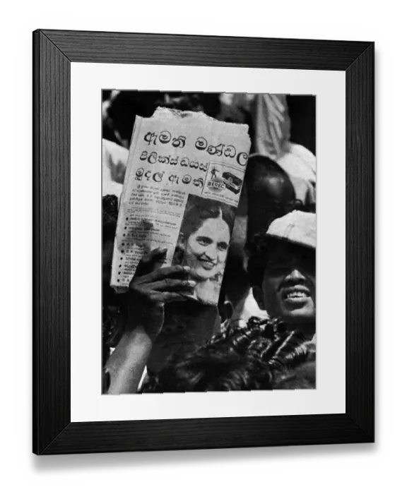 Framed Print : To shield his eyes from the scorching sun man uses newspaper photo of Sirimavo Bandaranike, the world's first woman Prime minister as he listens to her at a public meeting in anuradhapura in Ceylon Sri Lanka 1960