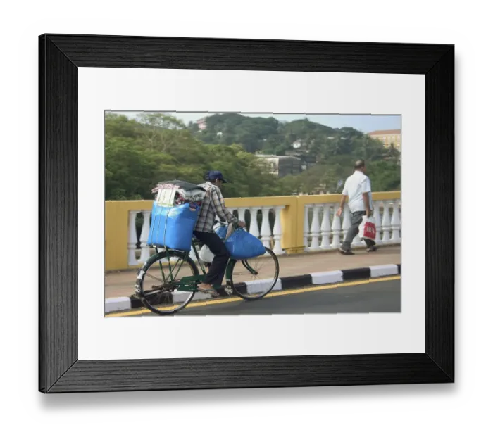 Framed Print : Blue luggage being transported on a bicycle over Old Pato bridge, Yellow bridge on the Mandovi River, Mahatma Gandhi Road, Panjim, Goa, India, Asia