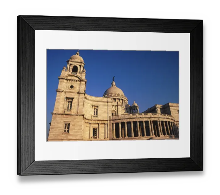 Framed Print : Side view of Victoria Memorial, Built between 1906 and 1921 in memory of Queen Victoria Topped with moving angel Statue, Kolkata, West Bengal, India, Asia