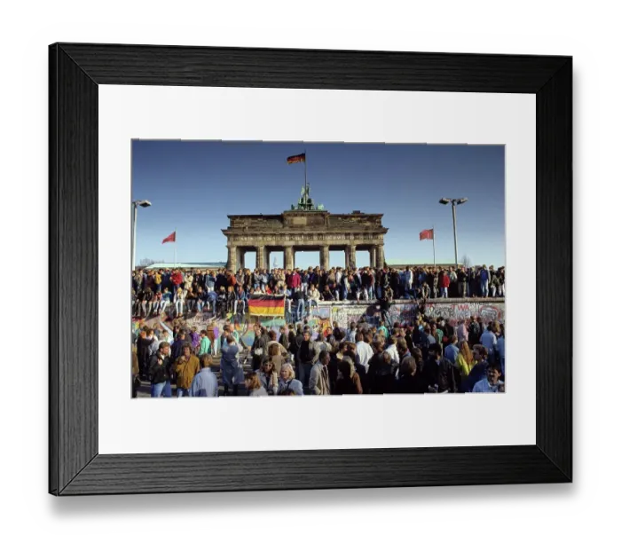 Framed Print : Fall of the Berlin Wall: people from East and West Berlin climbing on the Wall at the Brandenburg Gate, Berlin, Germany, Europe