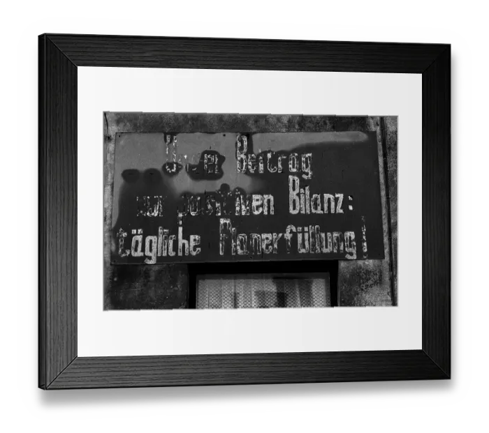 Framed Print : Germany, Sternberg, 01.02.1992, Plan fulfilment sign: Our contribution to the positive balance: daily plan fulfilment!, Europe Framed Print : Germany, Sternberg, 01.02.1992, Plan fulfilment sign: Our contribution to the positive balance: daily plan fulfilment!, Europe
