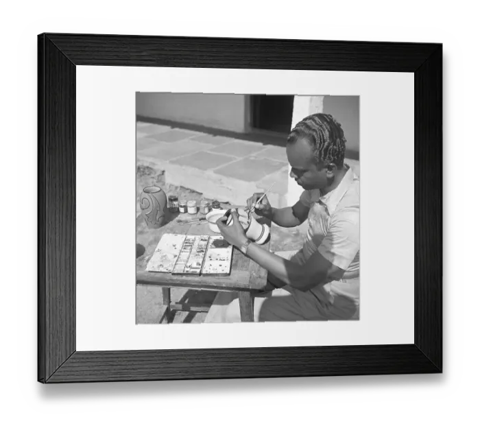 Framed Print : Man using portable rotating lathe applying lacquer to a wringtinforia wood, painting lacquer toys, Channapatna, Karnataka