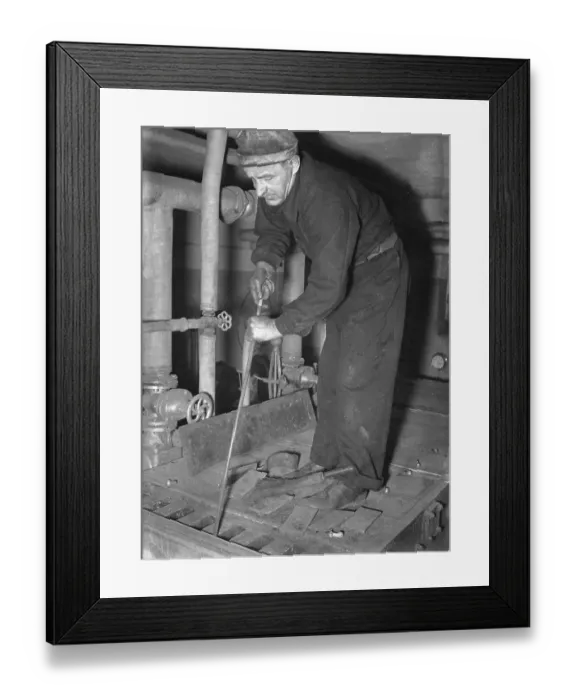 Framed Print : Sweeper in 1940. A chimney sweep working to clean the boiler room, using special tools for the purpose. June 1940. Kristoffersson ref 154-10 Framed Print : Sweeper in 1940. A chimney sweep working to clean the boiler room, using special tools for the purpose. June 1940. Kristoffersson ref 154-10