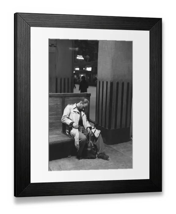 Framed Print : Stockholm Central Station in 1954. The large central hall is where everyone passes from and to the trains. A man has fallen asleep sitting on one of the benches, still with his hand around the handle of his bag. Kristoffersson ref 1-12 Framed Print : Stockholm Central Station in 1954. The large central hall is where everyone passes from and to the trains. A man has fallen asleep sitting on one of the benches, still with his hand around the handle of his bag. Kristoffersson ref 1-12