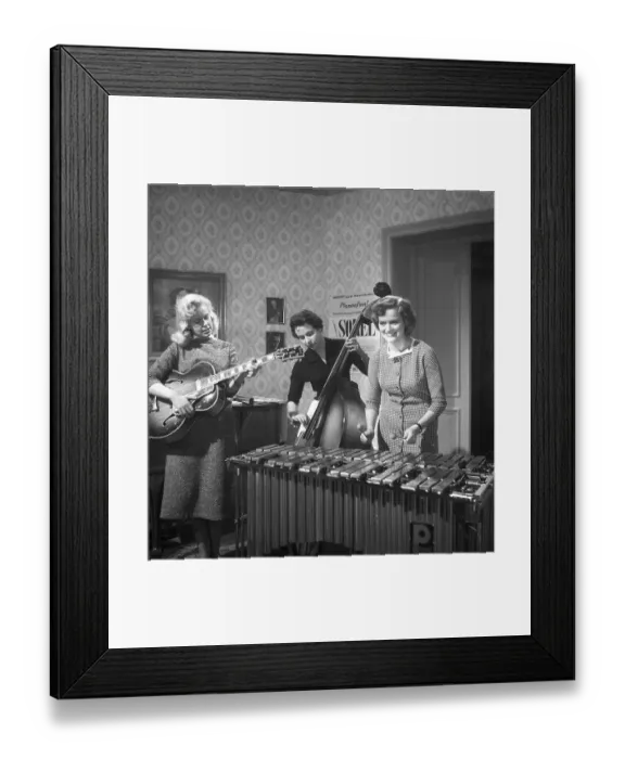 Framed Print : Trio 1956. The photograph, taken in 1956, captures three young women in a band, each immersed in their performance