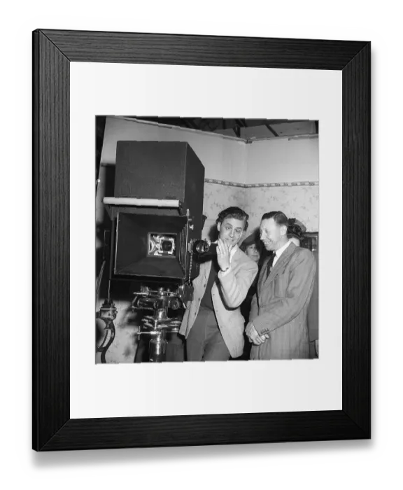 Framed Print : George Formby British singer, musician and actor (1904-1961), known as the Ukulele man. Here during a visit to Sweden on 14 May 1946. George Formby was the highest paid artist in England in 1940. Here with George Fant in the studio of Euorpa Films