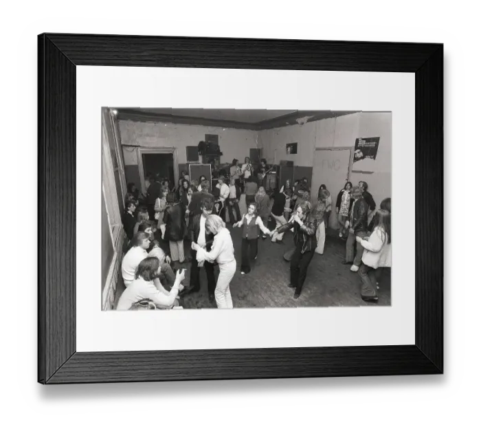 Framed Print : This is how people partied in the 1970s. People dance and drink beer while a band plays live music. Women and men dance to the music, drink beer and smoke in a rather dull party room that everyone somehow seems to enjoy and have fun in. 1970