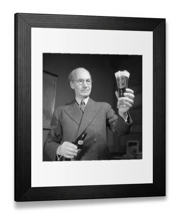 Framed Print : Erik Olson (1886-1966) Swedish industrialist. Head of the Pripp & Lyckholm brewery in Gothenburg. He is seen having poured the content of a bottle of beer of his own companies production into a beer glass and looks happy with what he is seing. 1943 Framed Print : Erik Olson (1886-1966) Swedish industrialist. Head of the Pripp & Lyckholm brewery in Gothenburg. He is seen having poured the content of a bottle of beer of his own companies production into a beer glass and looks happy with what he is seing. 1943