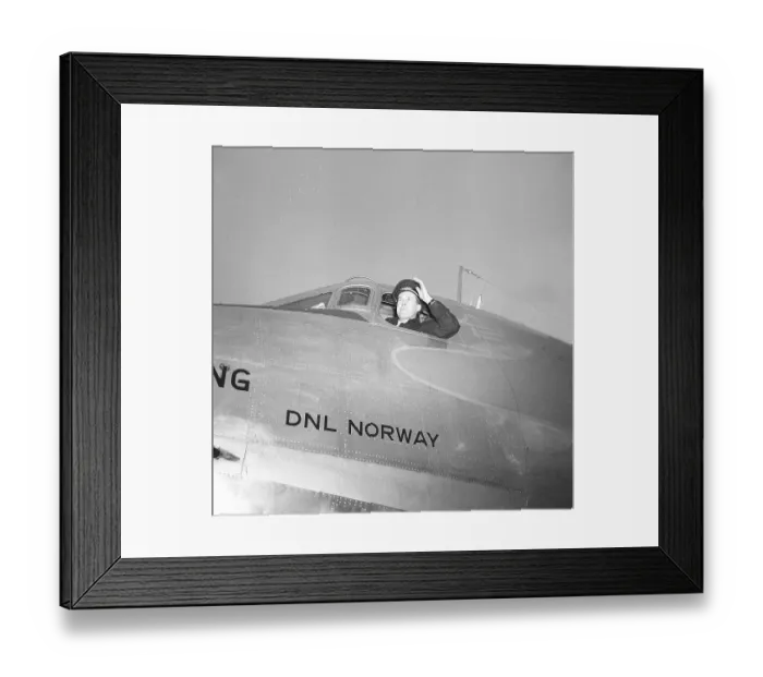 Framed Print : A pilot has opened the window of the cockpit of a DC3 passenger plane, looking out before take-off. The aircraft belongs to the Norwegian airline DNL Det Norske Luftfartselskap. It was Norway's national airline between 1938-1948 Framed Print : A pilot has opened the window of the cockpit of a DC3 passenger plane, looking out before take-off. The aircraft belongs to the Norwegian airline DNL Det Norske Luftfartselskap. It was Norway's national airline between 1938-1948