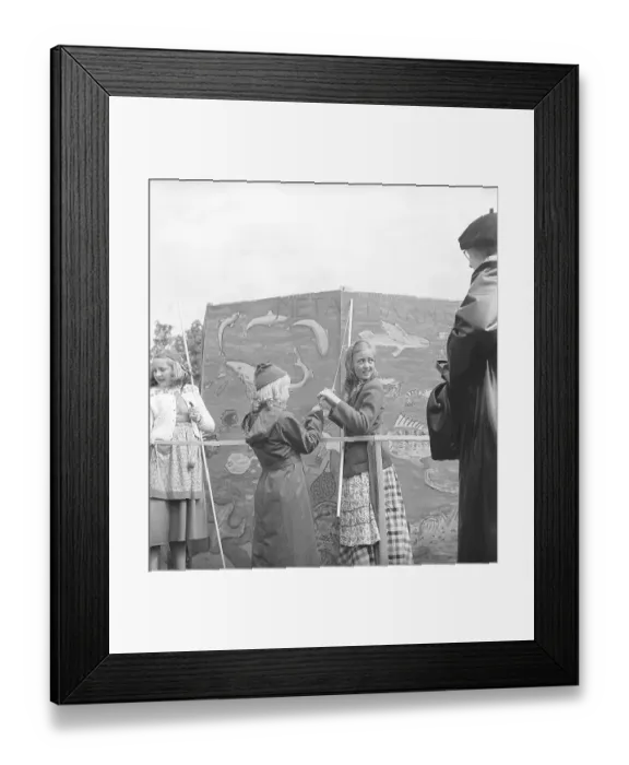 Framed Print : Children in the 1940s. Two girls are catching something in the classic game of fish pond. A string with a clothespin instead of a fishing hook is attached to a stick that is supposed to represent a fishing rod Framed Print : Children in the 1940s. Two girls are catching something in the classic game of fish pond. A string with a clothespin instead of a fishing hook is attached to a stick that is supposed to represent a fishing rod