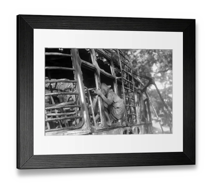 Framed Print : Street urchin enters burnt bus as rioters put in on fire after religious fundamentalists demolished the Babri Masjid in Ayodhya in Uttar Pradesh on 6 December 1992, The rioting continued till January 1993 in Bombay now Bombay Mumbai, Maharashtra Framed Print : Street urchin enters burnt bus as rioters put in on fire after religious fundamentalists demolished the Babri Masjid in Ayodhya in Uttar Pradesh on 6 December 1992, The rioting continued till January 1993 in Bombay now Bombay Mumbai, Maharashtra