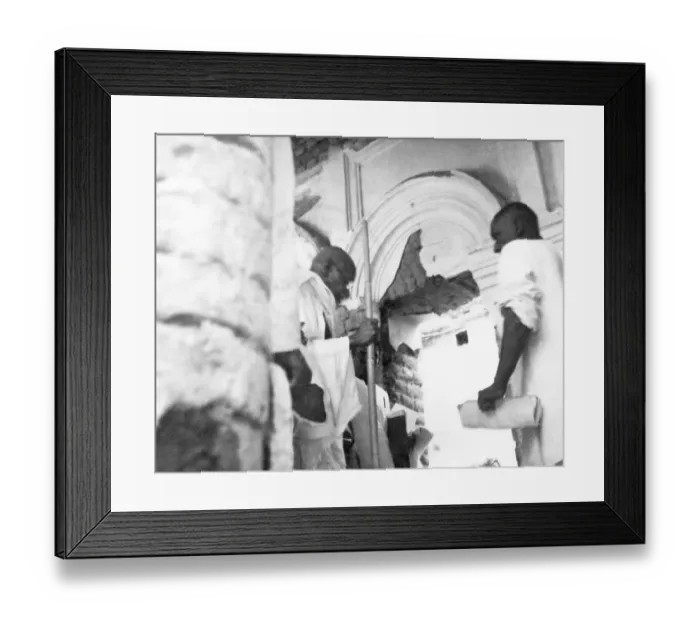 Framed Print : Mahatma Gandhi and others entering a house damaged by the riots between Hindus and Muslims in Noakhali East Bengal Framed Print : Mahatma Gandhi and others entering a house damaged by the riots between Hindus and Muslims in Noakhali East Bengal