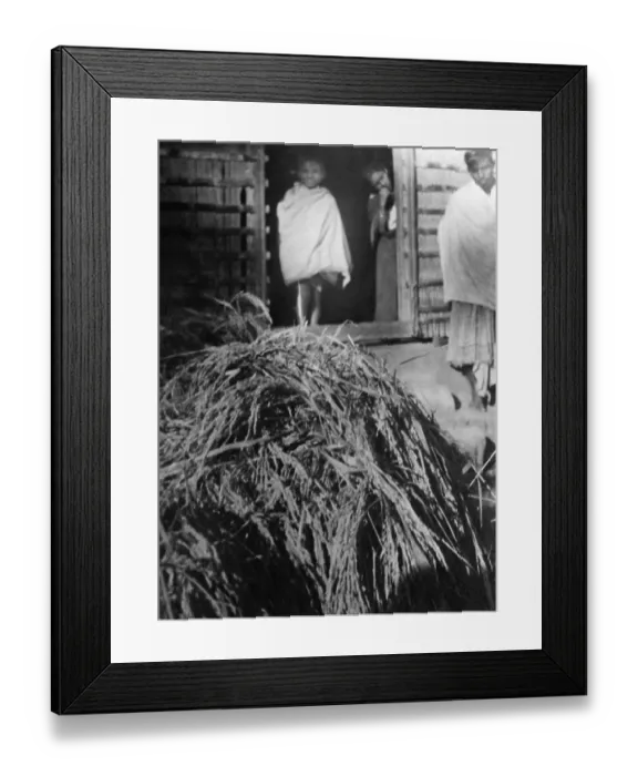 Framed Print : A pile of hay in front of a hut in the riot effected area of Noakhali East Bengal, November 1946, India, Asia