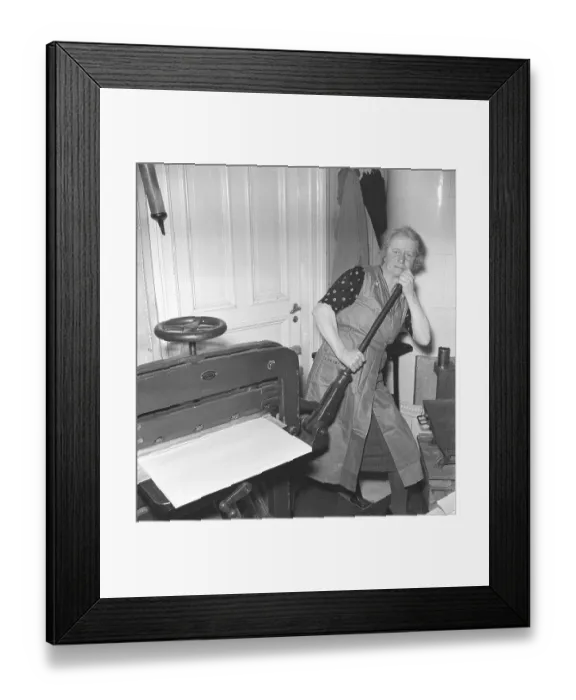 Framed Print : Bookbindery 1947. A lady works at the paper cutting machine. She has the paper sheets arranged to the size she wants and uses her muscle power on a lever to cut them. Kristoffersson ref AF27-1 Framed Print : Bookbindery 1947. A lady works at the paper cutting machine. She has the paper sheets arranged to the size she wants and uses her muscle power on a lever to cut them. Kristoffersson ref AF27-1