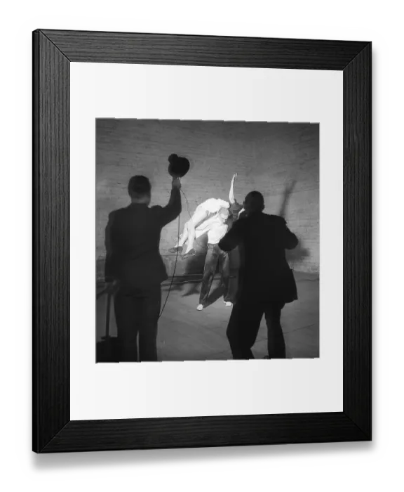 Framed Print : The photograph, taken in 1946, captures a dramatic and theatrical moment inside what appears to be a studio or performance space Framed Print : The photograph, taken in 1946, captures a dramatic and theatrical moment inside what appears to be a studio or performance space