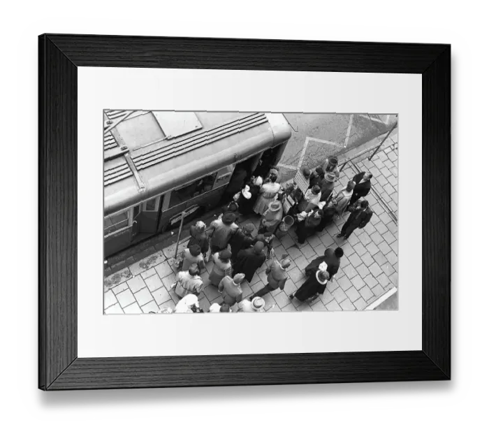Framed Print : Bus stop in Stockholm in 1953. People are waiting for the bus at the bus stop. Bus 32 travelling on the Fleminggatan-Fridhemsplan line has stopped and people have started to get on the bus