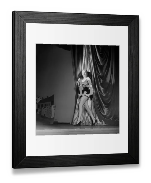 Framed Print : At the theatre 1951. A young woman holds a sign with the number thirteen in her hands on a theatre stage. It was common that beautiful girls paraded on stage between stage acts holding numbers marking the next act in the show Framed Print : At the theatre 1951. A young woman holds a sign with the number thirteen in her hands on a theatre stage. It was common that beautiful girls paraded on stage between stage acts holding numbers marking the next act in the show