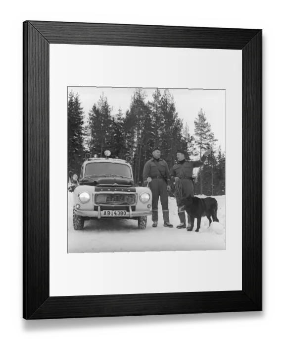 Framed Print : Policemen with search dog 1969. Two policemen with a dog used to search and find missing people at their policecar a Volvo duett. The model was produced between 1953-1969. Svahn