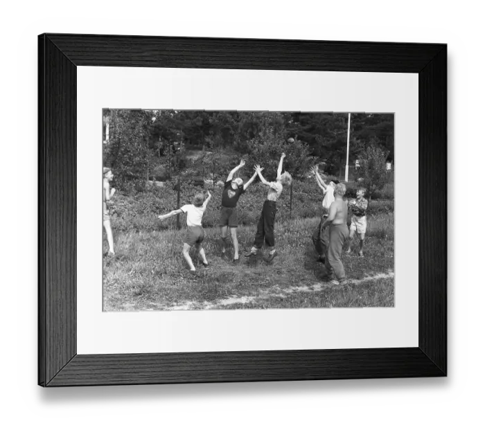 Framed Print : A group of boys playing outdoors, trying their best to reach the thrown ball first. 1954 Kristoffersson ref DV1