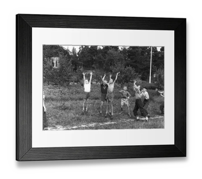Framed Print : A group of boys playing outdoors, trying their best to reach the thrown ball first. 1954 Kristoffersson ref DV1