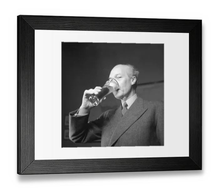 Framed Print : Erik Olson (1886-1966) Swedish industrialist. Head of the Pripp & Lyckholm brewery in Gothenburg. He is seen drinking out of a beer glass, the beer of his own companies production. 1943