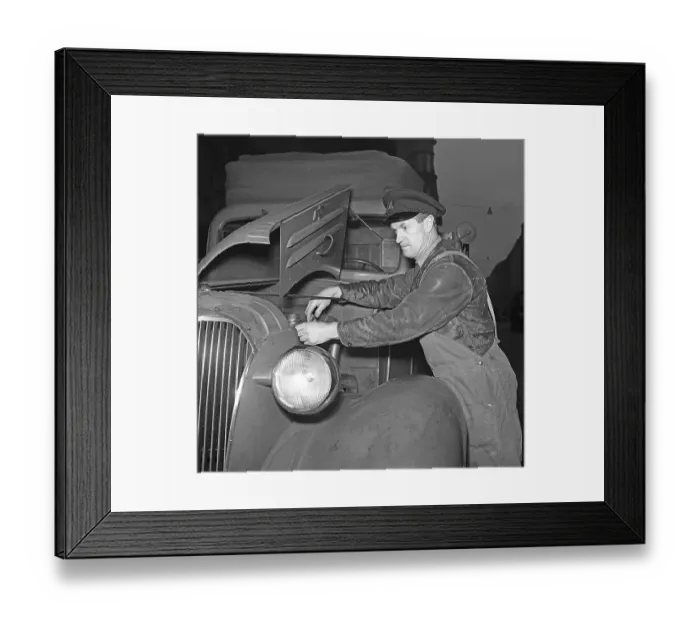 Framed Print : Chevrolet truck 1942. A truck driver at the company Arvid Nordquist in Stockholm is servicing the company's Chevrolet truck. 1942. The man has the hood open and is fixing or adjusting something in the engine Framed Print : Chevrolet truck 1942. A truck driver at the company Arvid Nordquist in Stockholm is servicing the company's Chevrolet truck. 1942. The man has the hood open and is fixing or adjusting something in the engine
