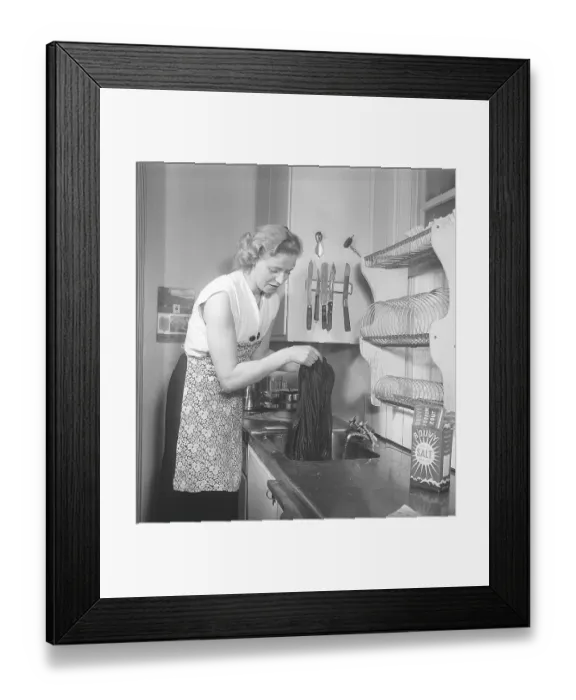 Framed Print : This is how it was done in the 1950s. A young woman stands at the kitchen sink and uses Bouvy salt with iodine to dye or wash her clothes. She rinses with clean water and looks pleased with the result. 1951. Kristoffersson ref BB67-11 Framed Print : This is how it was done in the 1950s. A young woman stands at the kitchen sink and uses Bouvy salt with iodine to dye or wash her clothes. She rinses with clean water and looks pleased with the result. 1951. Kristoffersson ref BB67-11