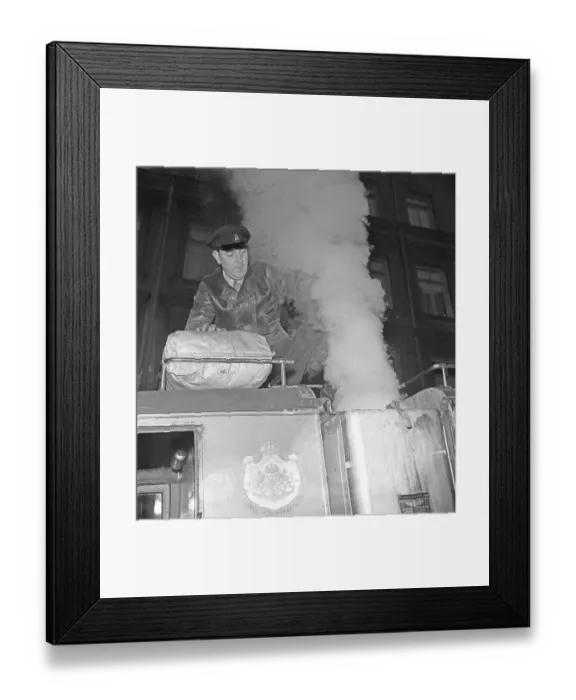 Framed Print : Wood gas 1942. A man fills more coal into the container to fuel the wood gas unit of his lorry. A natural feature during these years during the World War II was the Wood gasification unit on cars and trucks Framed Print : Wood gas 1942. A man fills more coal into the container to fuel the wood gas unit of his lorry. A natural feature during these years during the World War II was the Wood gasification unit on cars and trucks