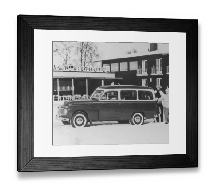 Framed Print : Volvo Duett. A Volvo Duett is parked outside a winter resort hotel. The design of the automobile is based on the Volvo PV sedan and shares its engine and front suspension with that model. The Duett was in production between 1953-1969