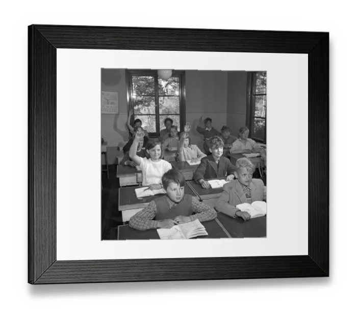 Framed Print : A classroom in 1952. Interior of a classroom where a class is sitting neatly in their school desks. The desks had a lid that could be opened. In the drawer underneath, the schoolgirls kept their books, pencils and school supplies Framed Print : A classroom in 1952. Interior of a classroom where a class is sitting neatly in their school desks. The desks had a lid that could be opened. In the drawer underneath, the schoolgirls kept their books, pencils and school supplies