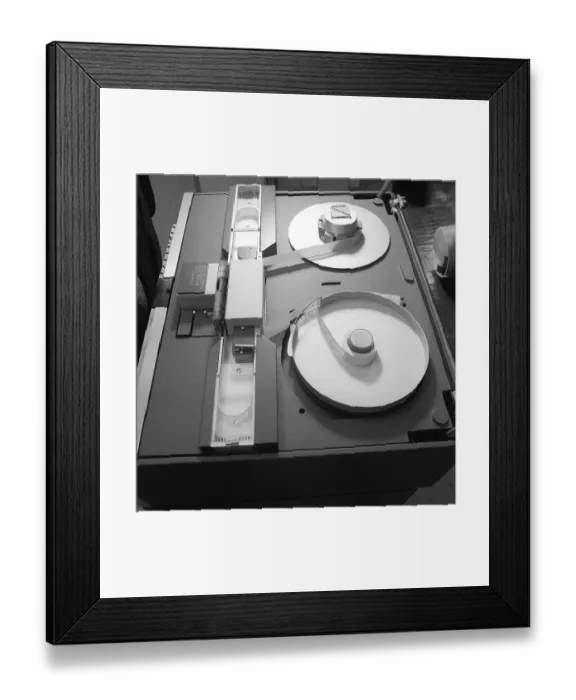 Framed Print : In the 1960s. A unit within a IBM system 360 and a punched tape reader in detail. The information that the punched holes represented was read and transferred further in the system to a storage media, a program, a tape unit Framed Print : In the 1960s. A unit within a IBM system 360 and a punched tape reader in detail. The information that the punched holes represented was read and transferred further in the system to a storage media, a program, a tape unit