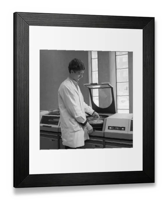 Framed Print : IBM mainframe system 360. A man in a room where some of the computer equipment is visible. The IBM 2311 Direct Access Storage Facility was introduced in 1964 for use in the entire System / 360 family of computers