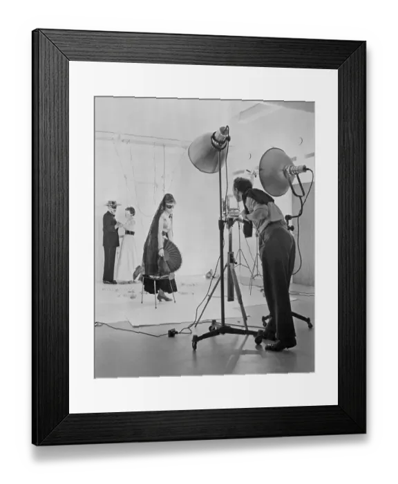 Framed Print : 1950s photographer and models. A young woman is dressed up as to be being on a masquerade party with her eyes covered and spanish clothes. In the background a Zorro-looking man dances with a woman. Sweden 1957
