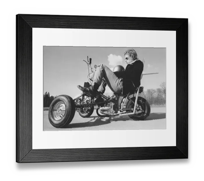 Framed Print : The world's fastest moped in 1973. A teenager sits on what was called Sweden's fastest moped with a top speed of over 100 km / h. The frame and wheels were taken from a cargo moped and a disabled moped Framed Print : The world's fastest moped in 1973. A teenager sits on what was called Sweden's fastest moped with a top speed of over 100 km / h. The frame and wheels were taken from a cargo moped and a disabled moped