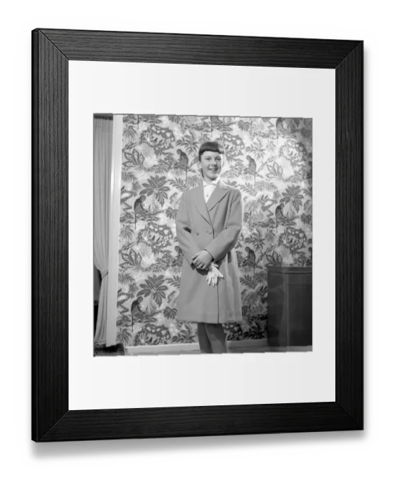 Framed Print : Girl in the 1950s. A teenage girl dressed in a coat of the typical look of the decade