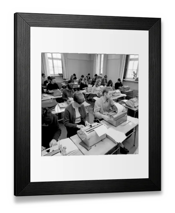 Framed Print : Learning to type in the 1960s. A classroom of students sitting at typewriters. A class and education in typing, using the right fingers and keys. 1968. Conard ref 5573