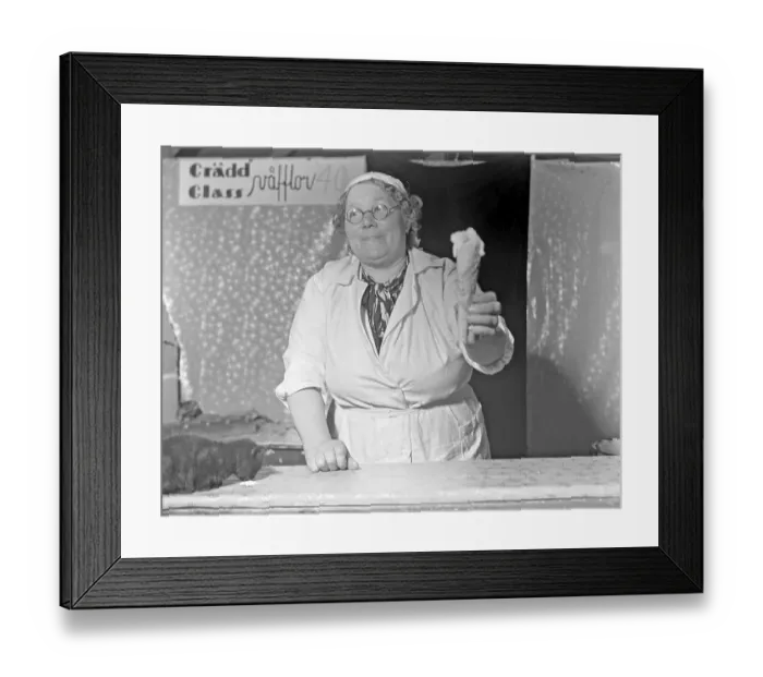 Framed Print : Ice cream in the 1940s. The woman selling ice cream is handing holding cone of vanilla ice cream