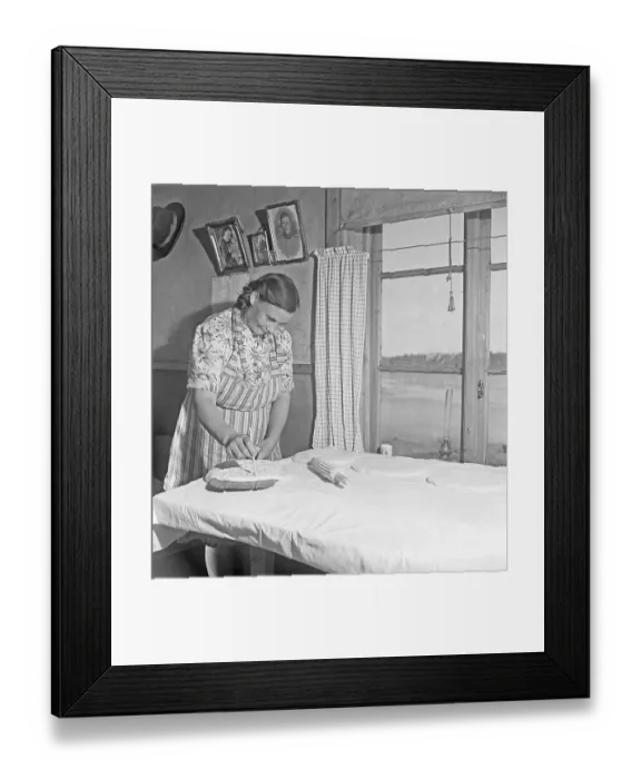 Framed Print : Baking bread 1949. Interior of a kitchen with a woman baking bread