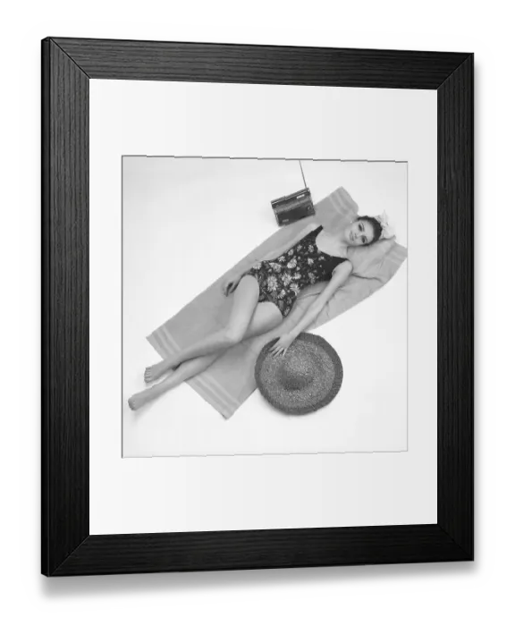 Framed Print : 1960s swimsuit fashion. A fashion model wearing the swimsuit fashion of 1963