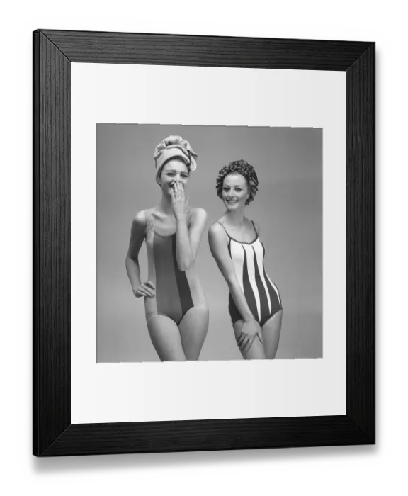 Framed Print : 1960s swimsuit fashion. Two models are wearing the swimsuit fashion of 1963