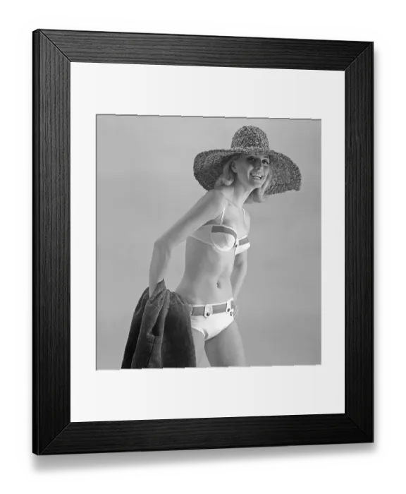 Framed Print : 1960s bikini fashion. A fashion model in a bikini in 1963