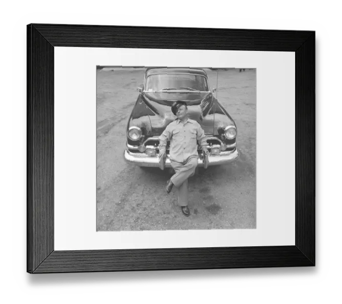 Framed Print : In the 1950s. A man by his car and he is visibly proud and maybe a little cocky. Perhaps not so strange as he is the owner of an impressive American car of the brand Chrysler Imperial Framed Print : In the 1950s. A man by his car and he is visibly proud and maybe a little cocky. Perhaps not so strange as he is the owner of an impressive American car of the brand Chrysler Imperial