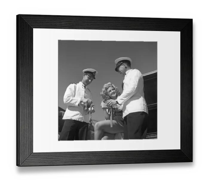 Framed Print : During World war II. Mary Thour who appears in the film along with two of the ship's real officers, Captain Bolling and Commander Captain DeMare on the armored cruiser Fylgia where some of the scenes were filmed