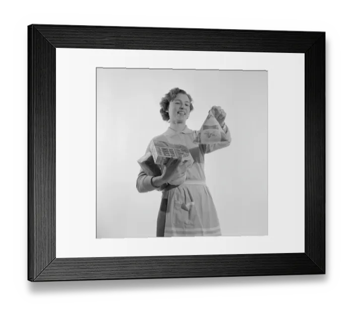 Framed Print : In the 1960s. A woman with groceries Framed Print : In the 1960s. A woman with groceries