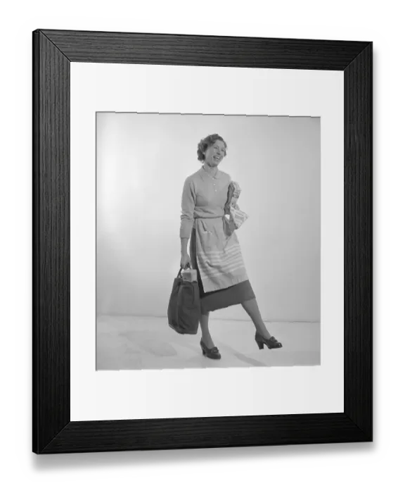 Framed Print : In the 1960s. A woman with her shopping bag. The classic Tetran milk package is visible. Invented by Ruben Rausings employee Erik Wallenberg in a tetrahedron form, that became the start of the Tetra Pak packaging empire. Sweden 1960. Conard ref 4188