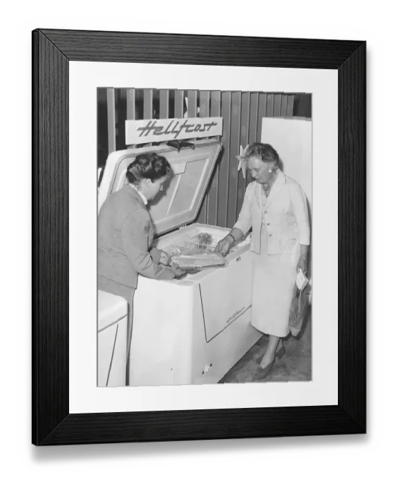 Framed Print : Freezer box in the 1950s. The manager of the appliance manufacturer Elektrohelio's test kitchen Mrs