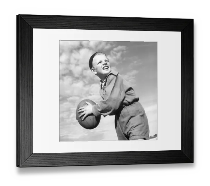 Framed Print : Rugby 1940. A young rugby player is holding the rugby ball, looking for someone to throw it to. The rugby ball has an oval shape, four panels and a weight of about 400 grams. 1942. Kristoffersson ref A56-4 Framed Print : Rugby 1940. A young rugby player is holding the rugby ball, looking for someone to throw it to. The rugby ball has an oval shape, four panels and a weight of about 400 grams. 1942. Kristoffersson ref A56-4